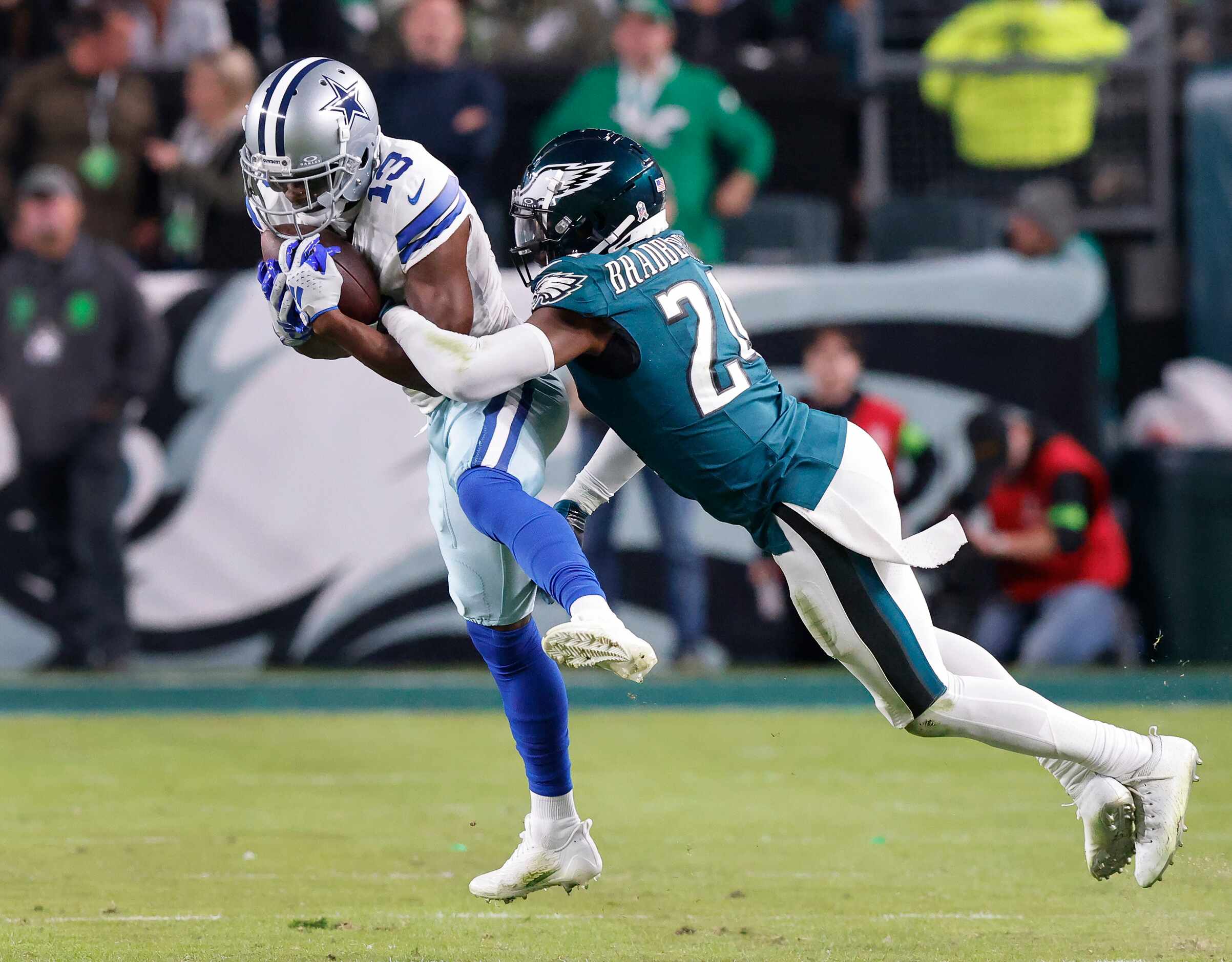Dallas Cowboys wide receiver Michael Gallup (13) makes a third quarter catch as he’s tackled...