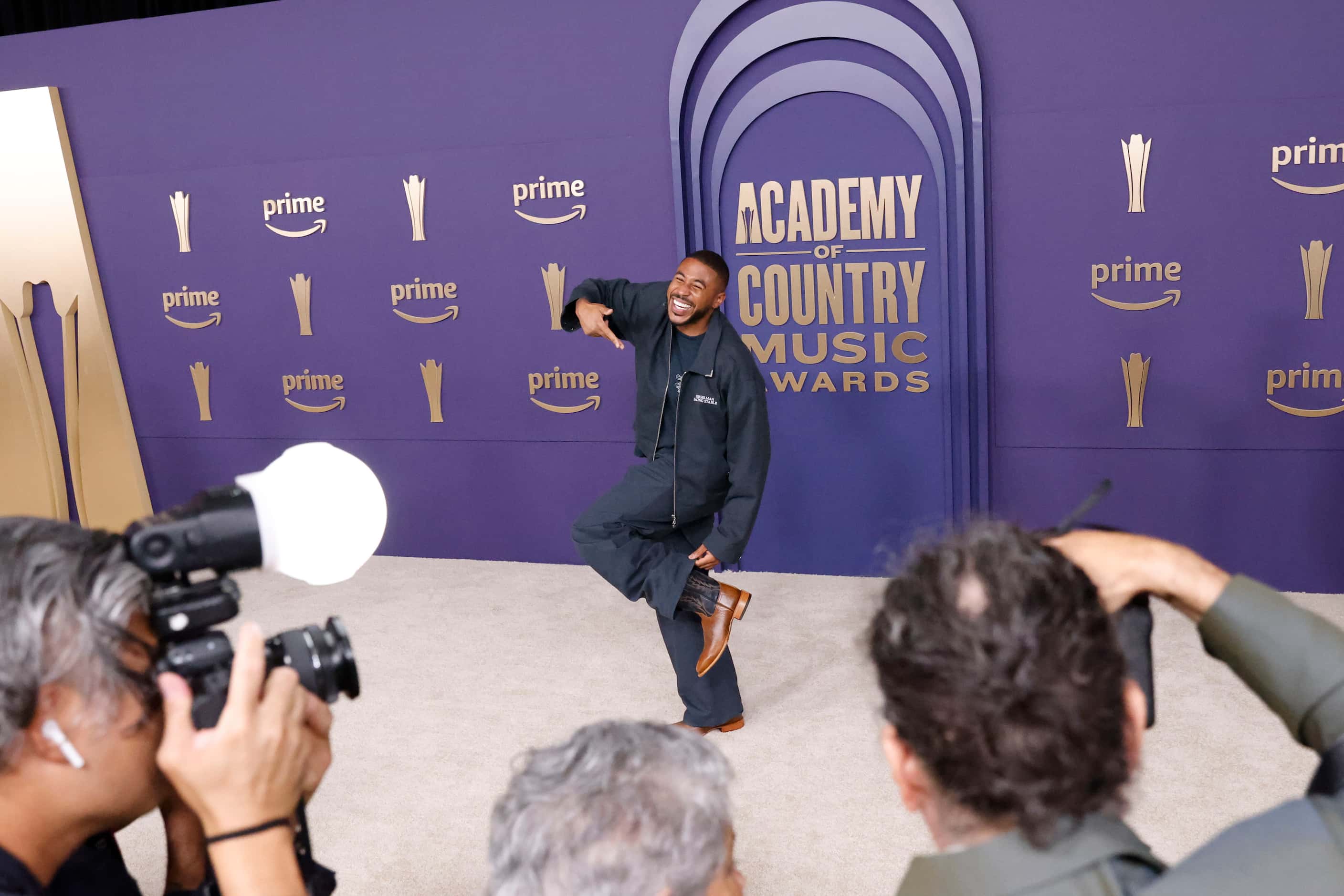  poses for a photo during the 59th Academy of Country Music Awards red carpet on on...