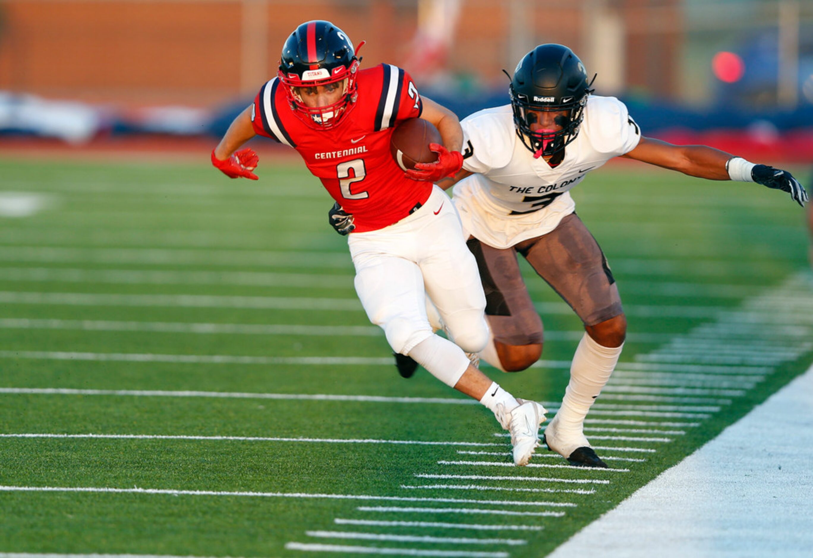 Centennial's Trysten Meadors (2) is tackled by The Colony's Christian Gonzalez (3) during...