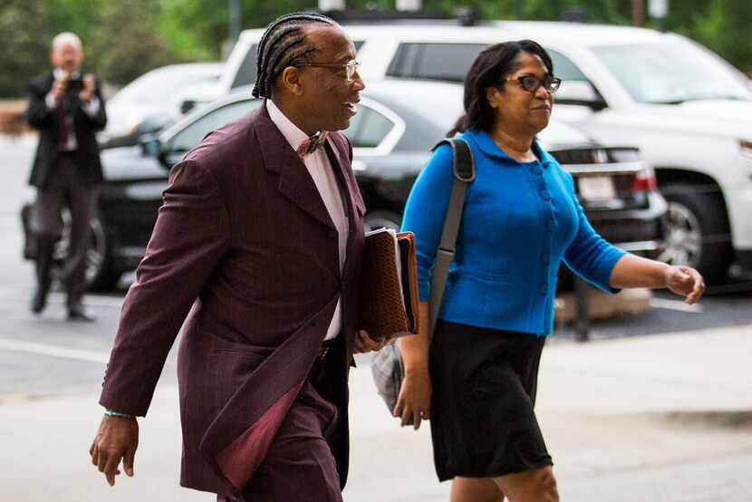 John Wiley Price walks to the federal courthouse last week with his chief of staff, Dapheny...