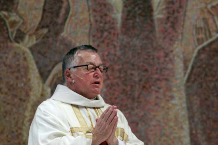The Rev. Stephen Bierschenk of St. Monica Catholic Church hopes his procession Sunday will...