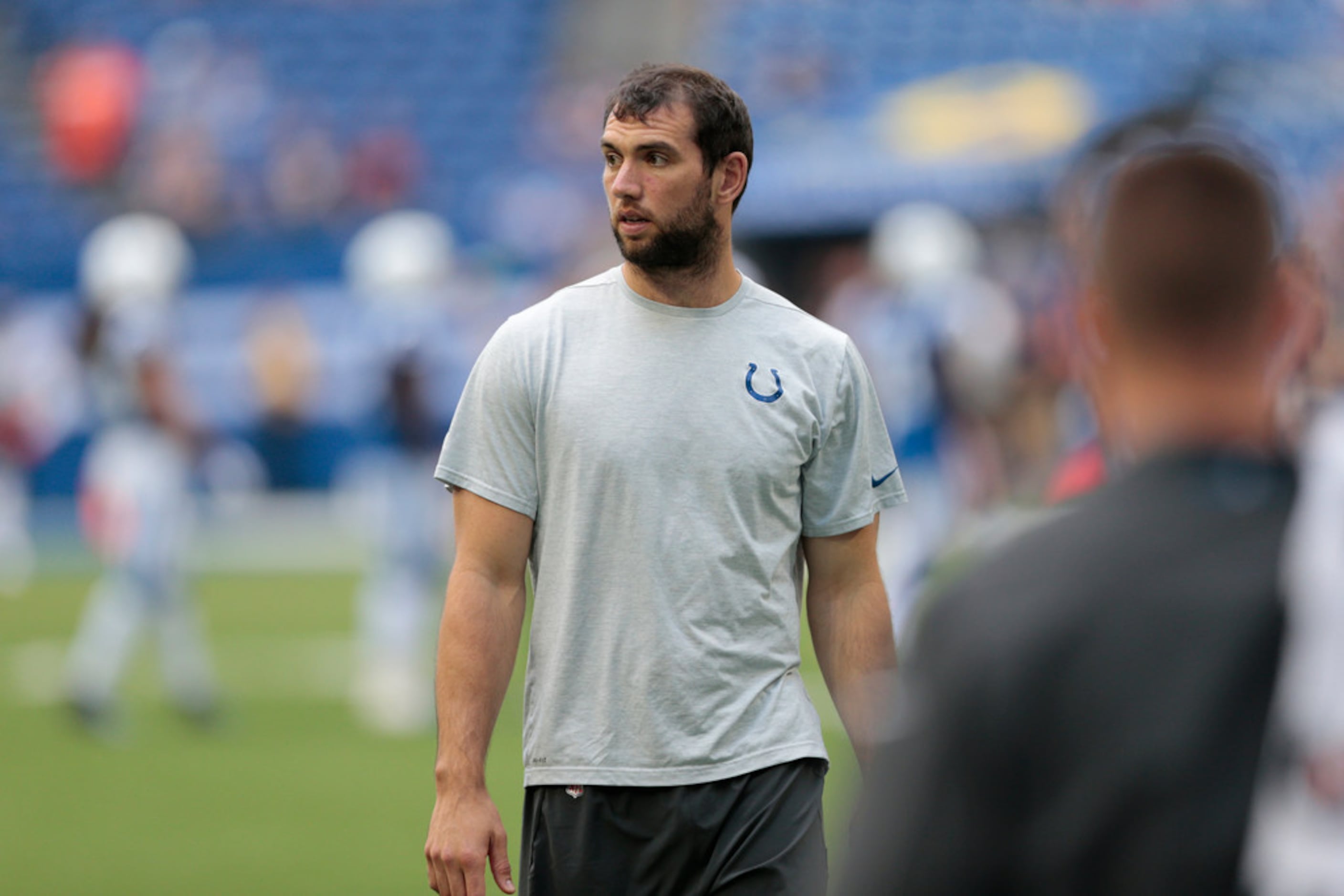 Colts quarterback Andrew Luck talks with media