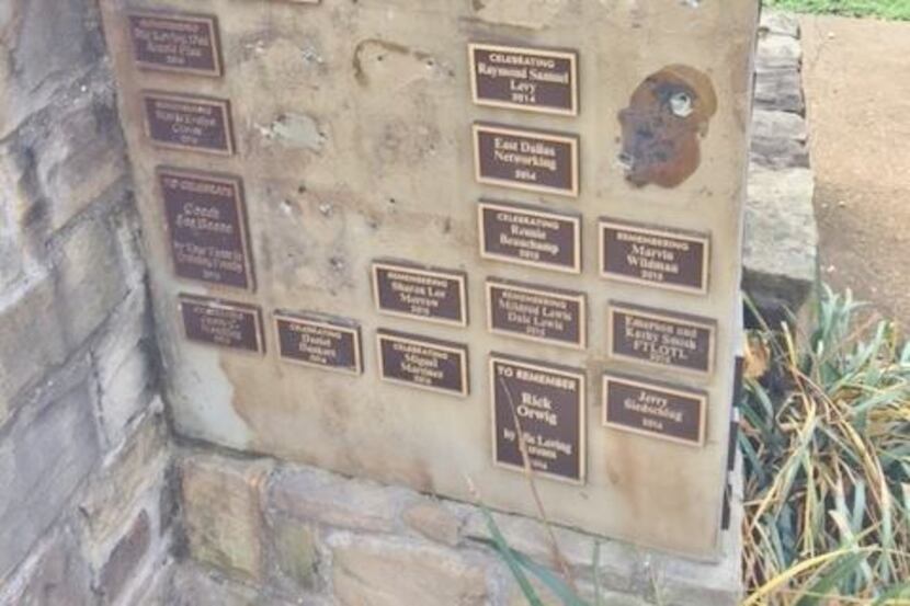 Plaques were pried from the memorial in Celebration Tree Grove.