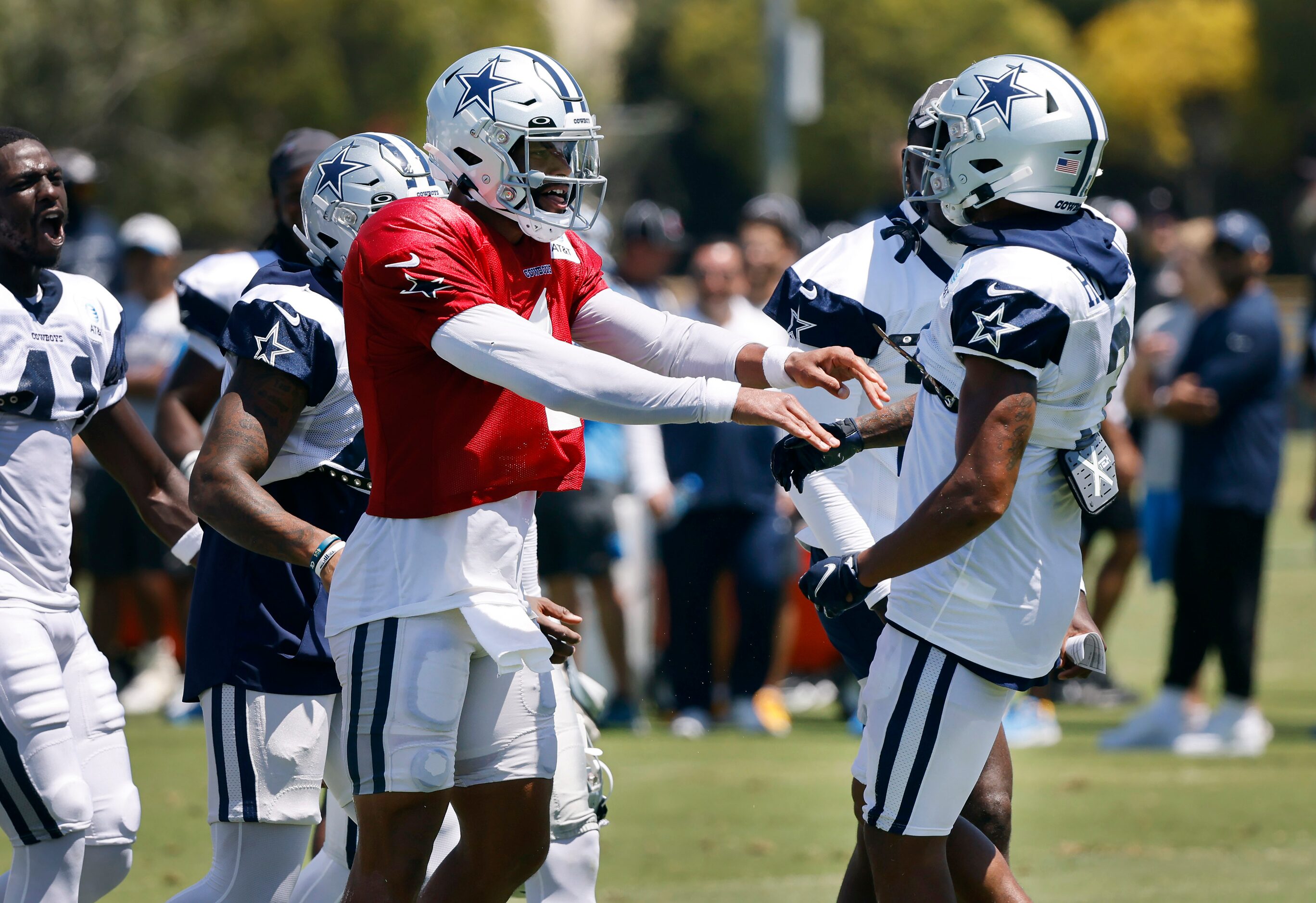 Dallas Cowboys quarterback Dak Prescott (4) congratulates wide receiver Dennis Houston (3)...