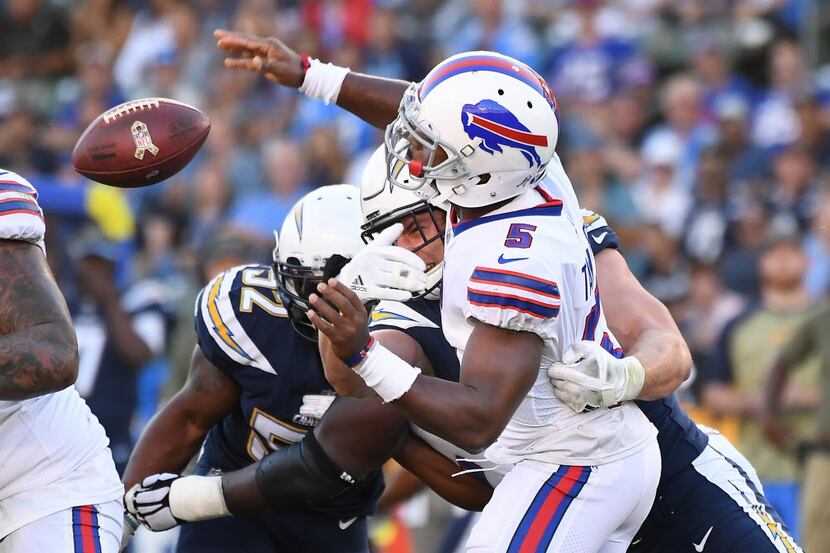 Los Angeles Chargers defensive end Joey Bosa forces Buffalo Bills quarterback Tyrod Taylor...