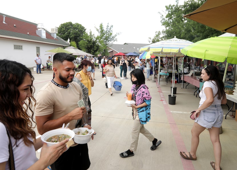 Guests enjoy the food and atmosphere during the Sunday Thai Food Market.