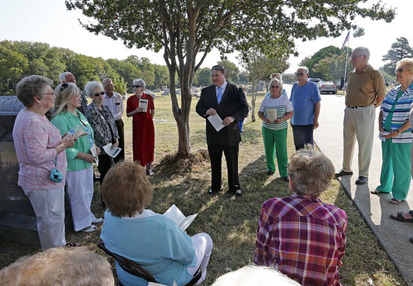 Wylie Mayor Eric Hogue (center) speaks to the crowd gathered for the unveiling of a Texas...