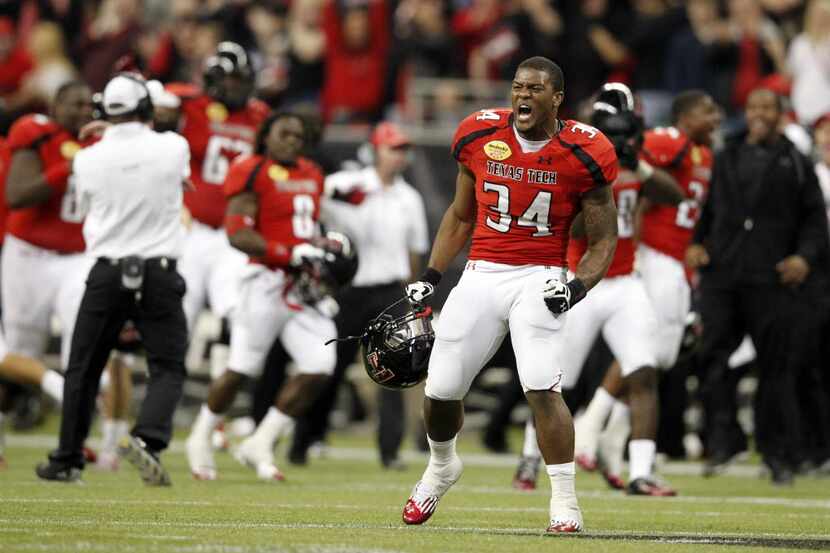 Texas Tech Red Raiders running back Kenny Williams (34) celebrates after teammate Texas Tech...