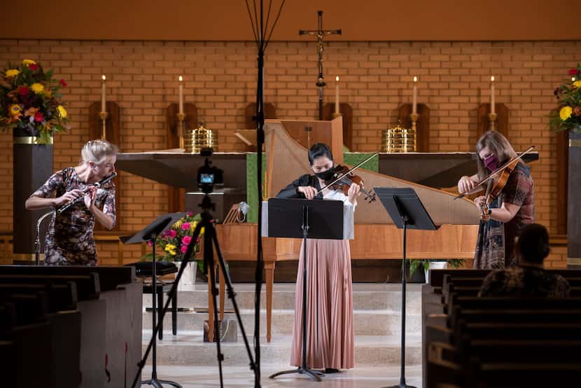 Flutist Taya König-Tarasevichn, violinists Ha Viet Dang (center) and Stephanie Noori perform...