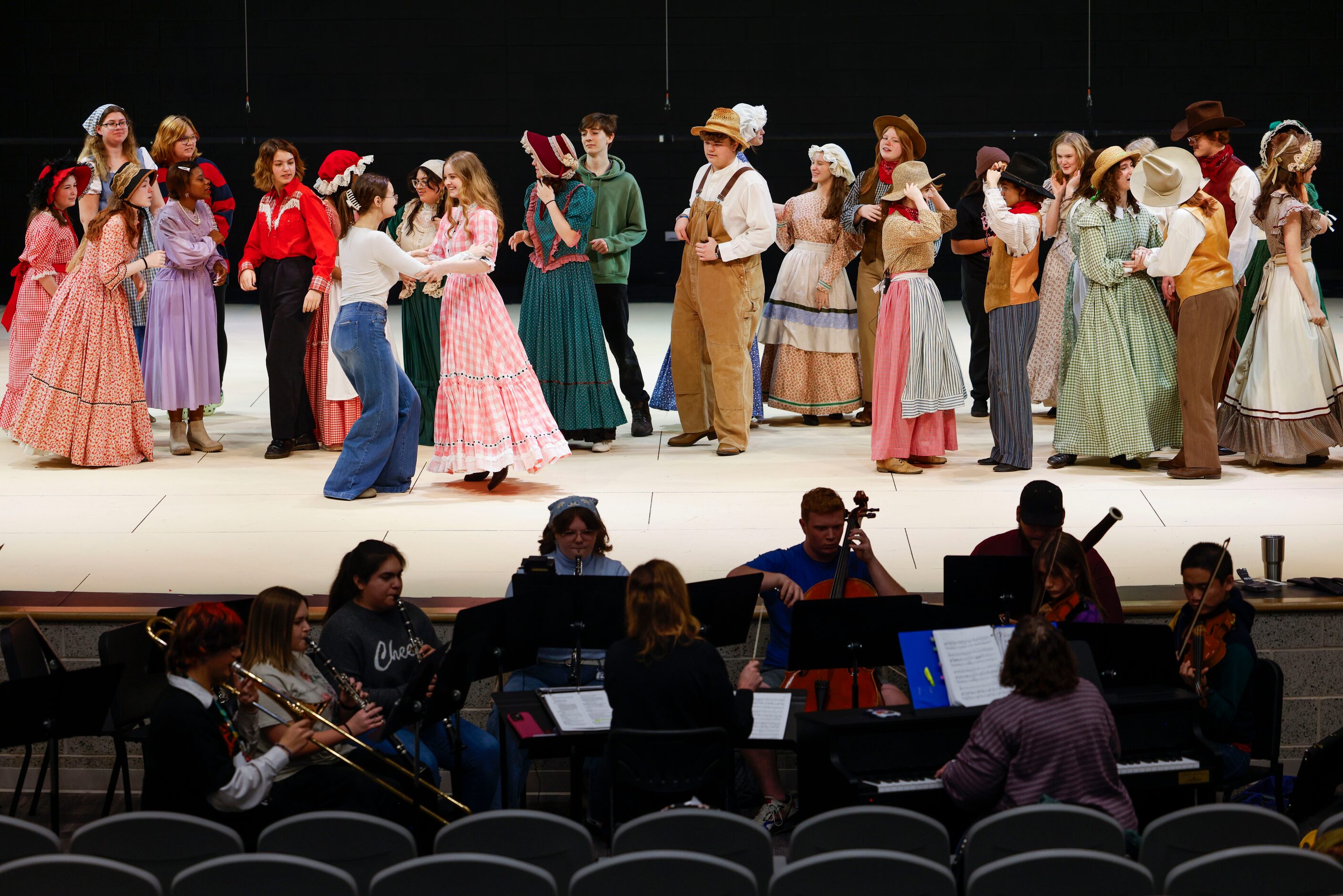 Cast members take part during a rehearsal for Oklahoma! on, Monday, Jan. 8, 2024, at Sherman...