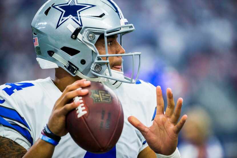 Dallas Cowboys quarterback Dak Prescott (4) warms up before their game against the...