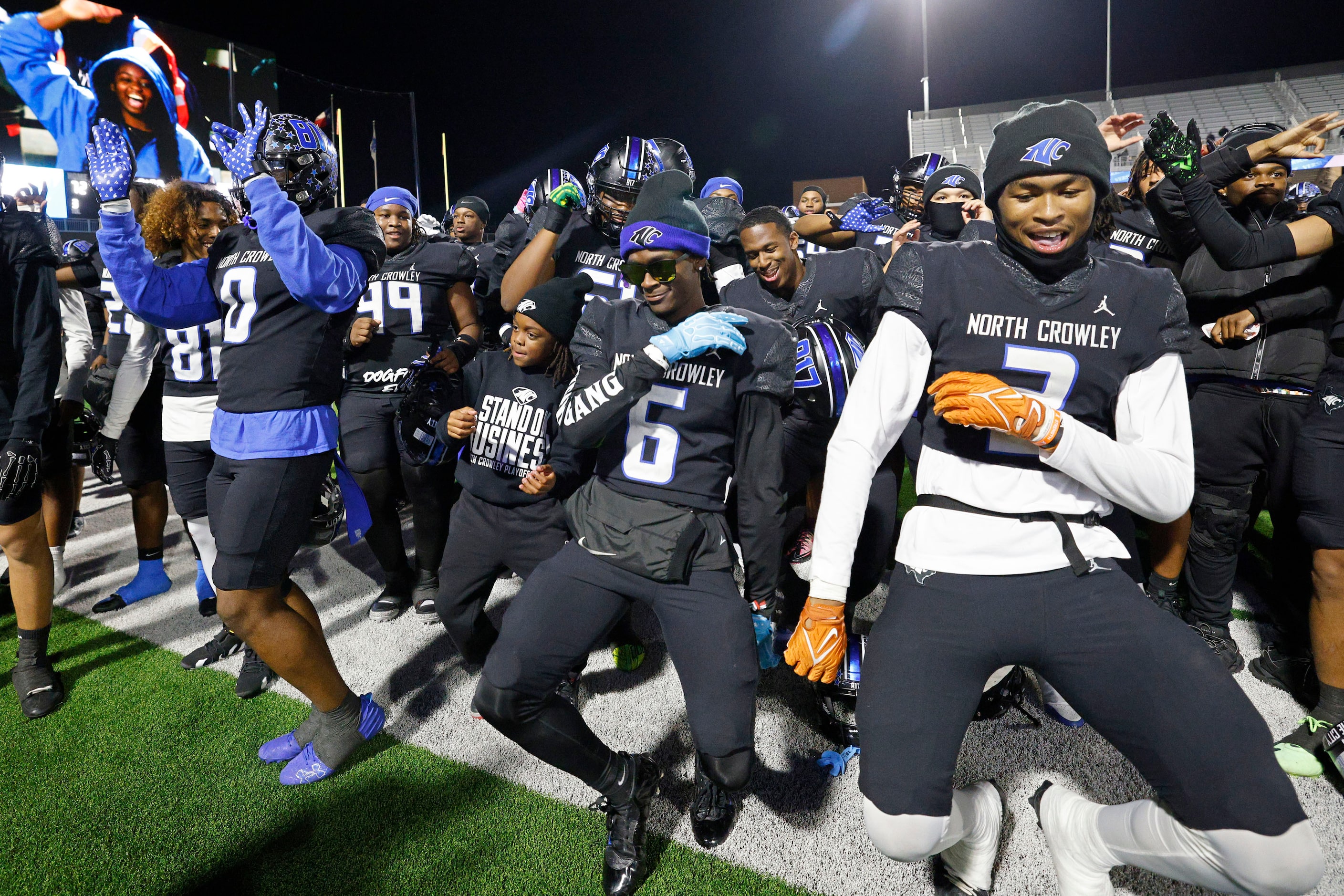 North Crowley players celebrate their 72-14 victory against Permian after a high school...