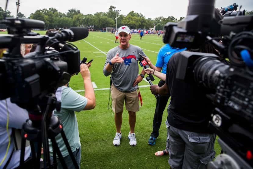 SMU head coach Chad Morris speaks to reporters during SMU's first football practice of the...