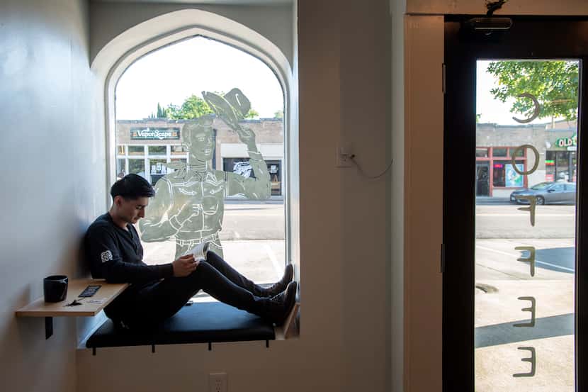 Best seat in the house? Ever Escobar, 20, finds a quiet spot to read at Wayward Coffee in...