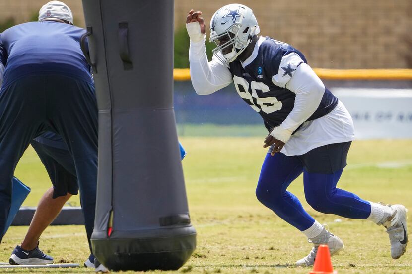 Dallas Cowboys defensive tackle Neville Gallimore (96) participates in a drill during a...