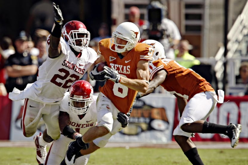 FILE - Texas wide receiver Jordan Shipley (8) tries to break away from Oklahoma defenders...