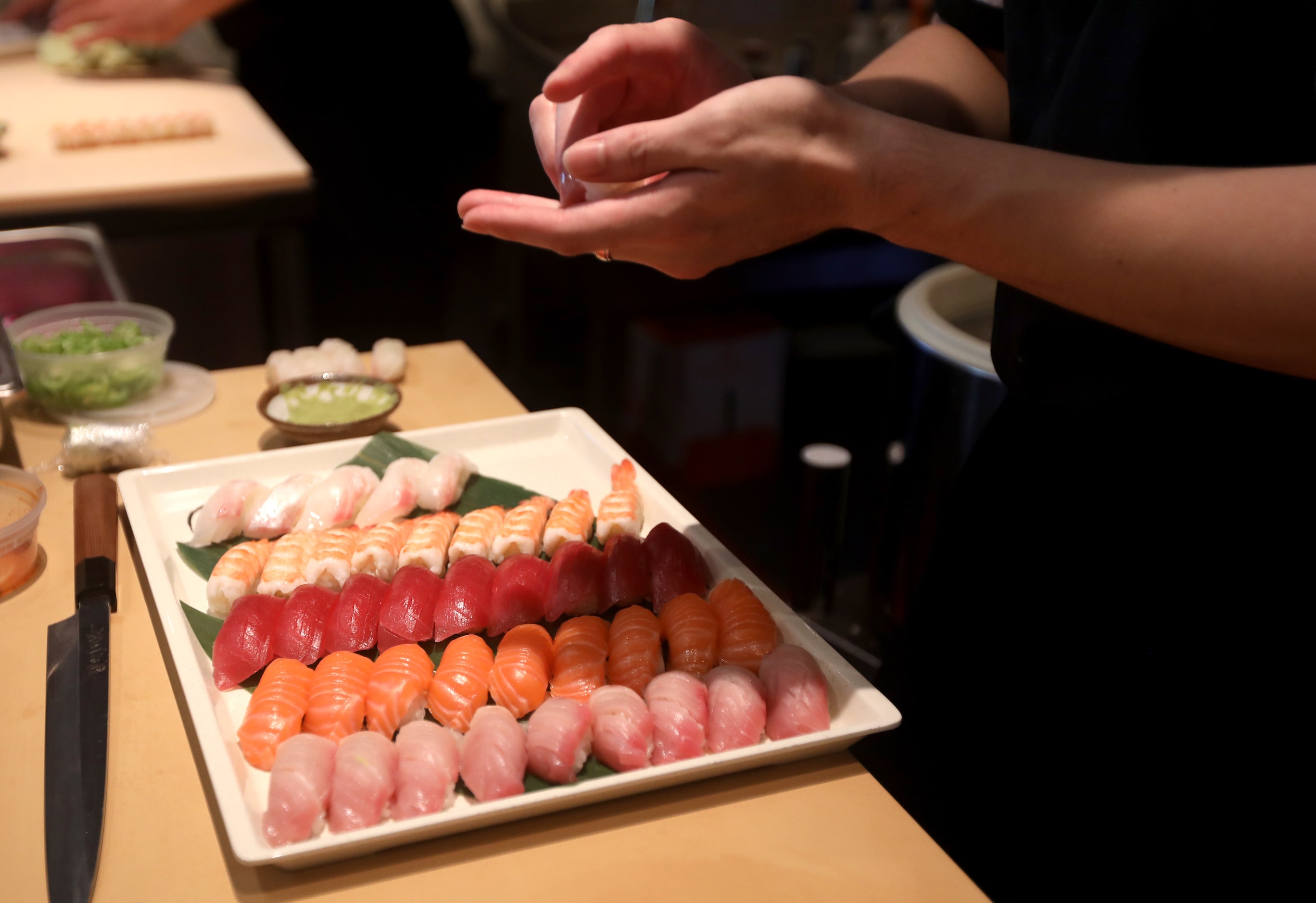 Sashimi is prepared at Feng Shui, a new restaurant in Dallas, Texas, Tuesday, October 22, 2024