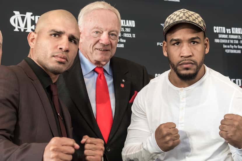 Miguel Cotto, left, and James Kirkland pose with Dallas Cowboys owner Jerry Jones during a...