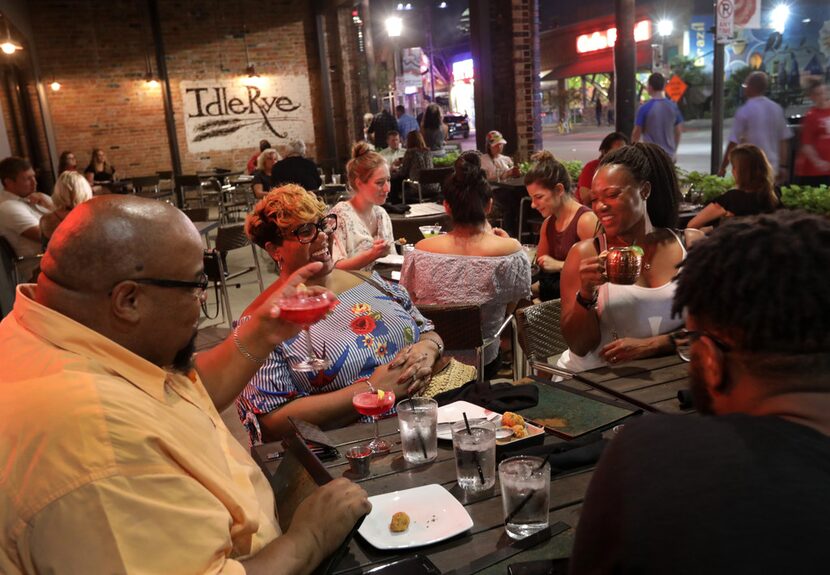 Patrons dine in a cavernous space meant to have a Prohibition Era-meets-steampunk vibe.