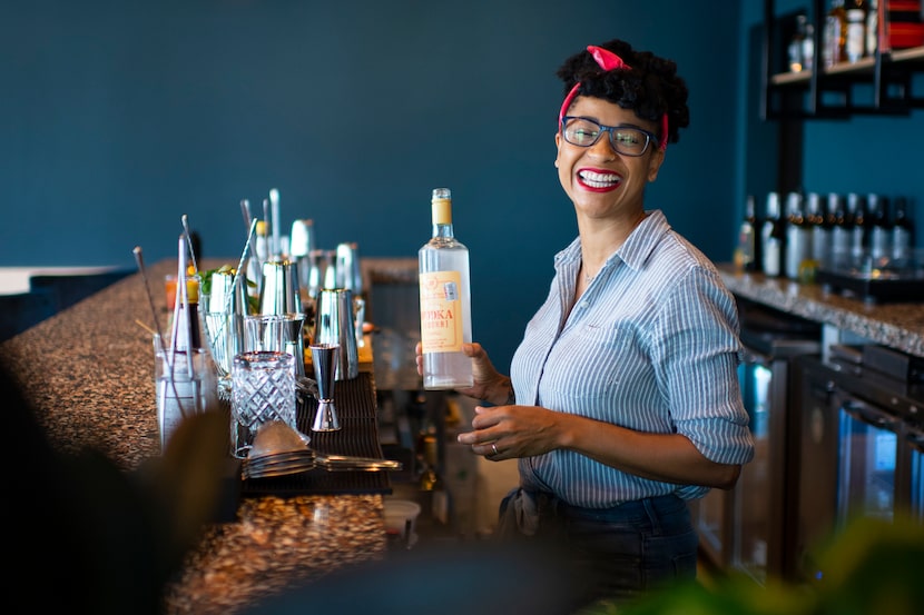 Bar Director Kimberly Schow shares a laugh with a coworker at Hotel Dryce in Fort Worth.