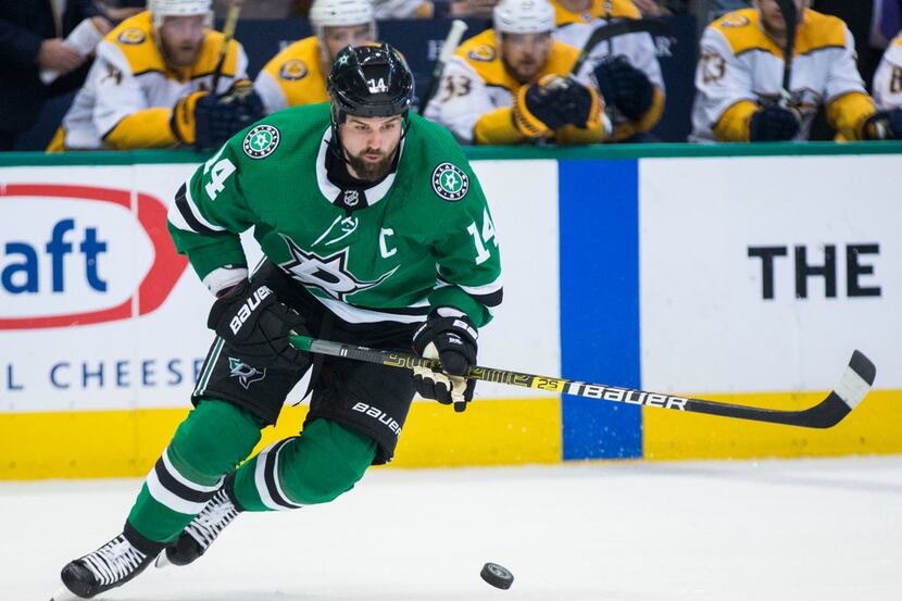 Dallas Stars left wing Jamie Benn (14) takes the puck during the first period of Game 6 of...