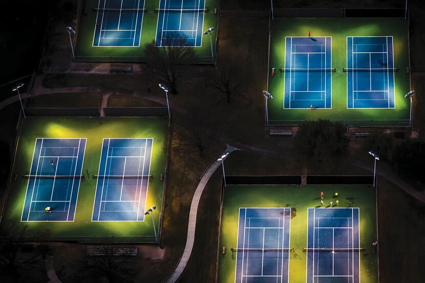 Nighttime Nadals and Navratilovas hit the courts at the Samuell Grand Tennis Center.