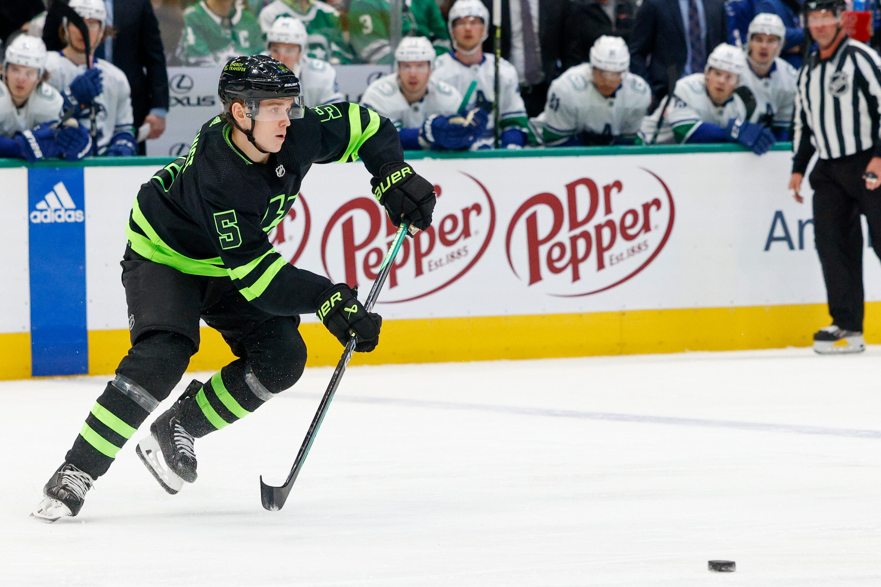 Dallas Stars defenseman Nils Lundkvist (5) pass the puck during the first period of an NHL...