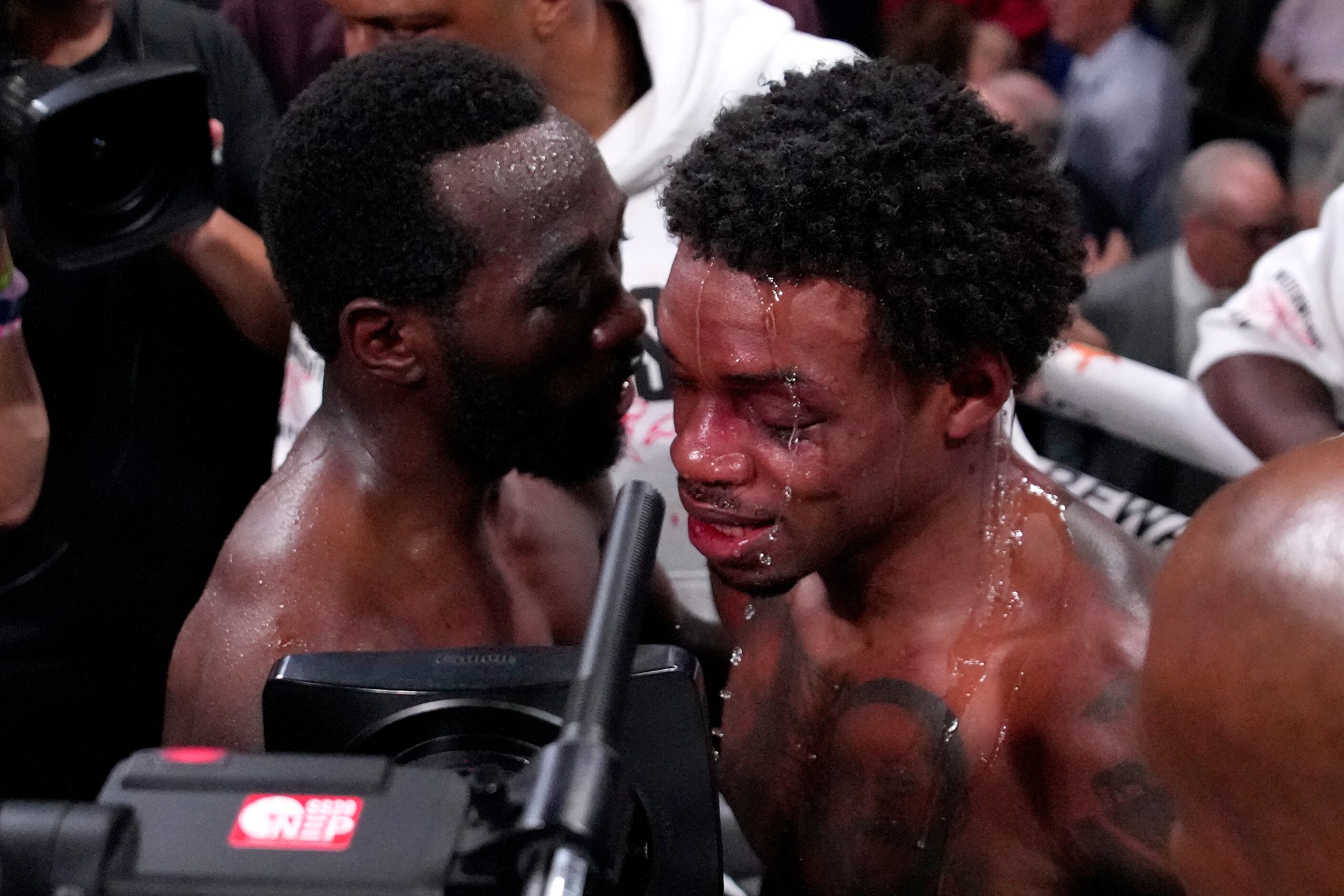 Terence Crawford, left, talks with Errol Spence Jr. fight after Crawford won their...