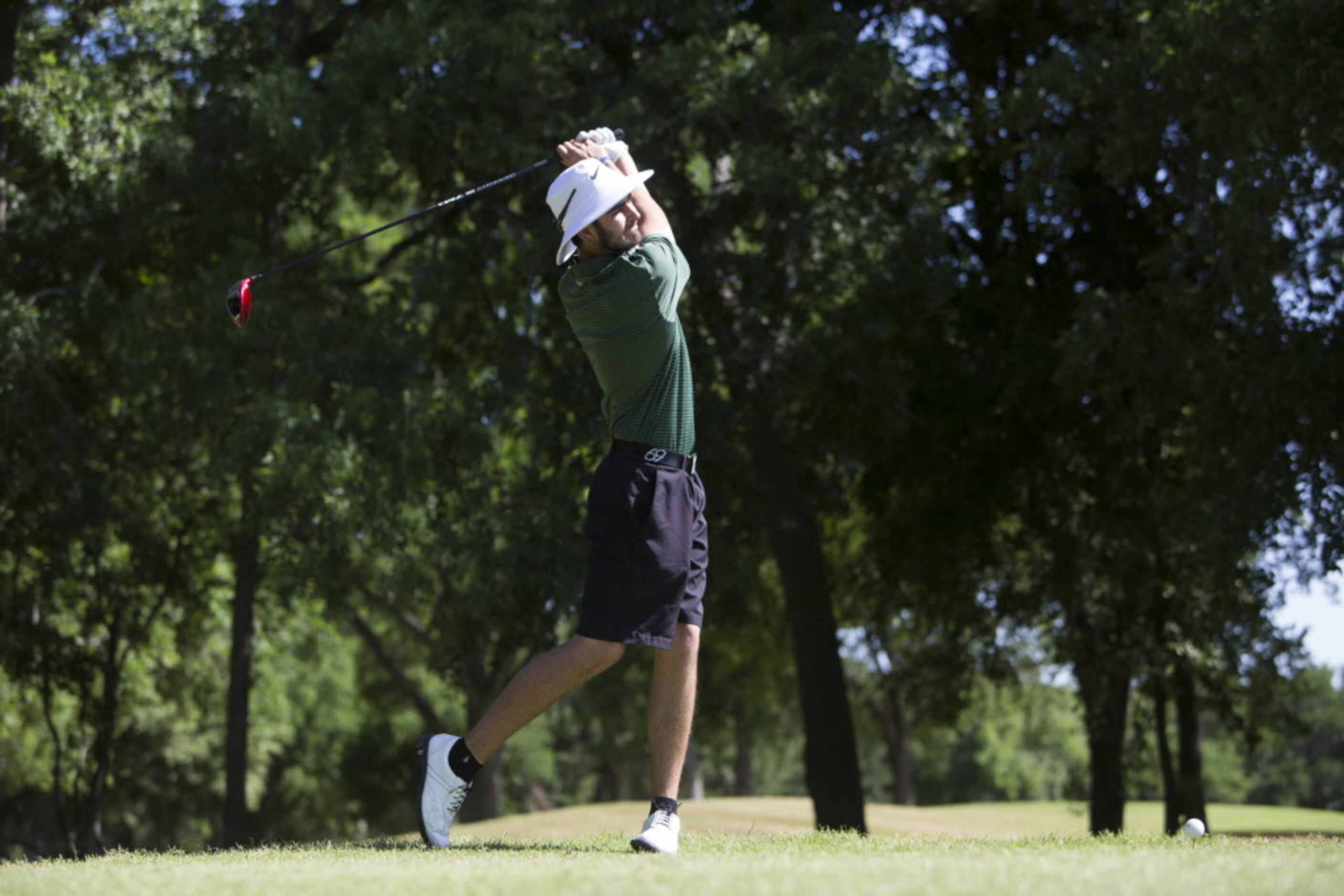 Southlake Carroll junior Trent Hill makes a drive on the fifth hole during the UIL 5A State...