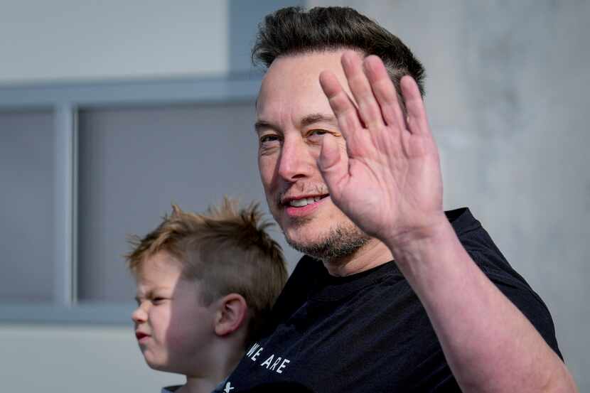 FILE - Tesla CEO Elon Musk waves as he leaves the Tesla Gigafactory for electric cars after...