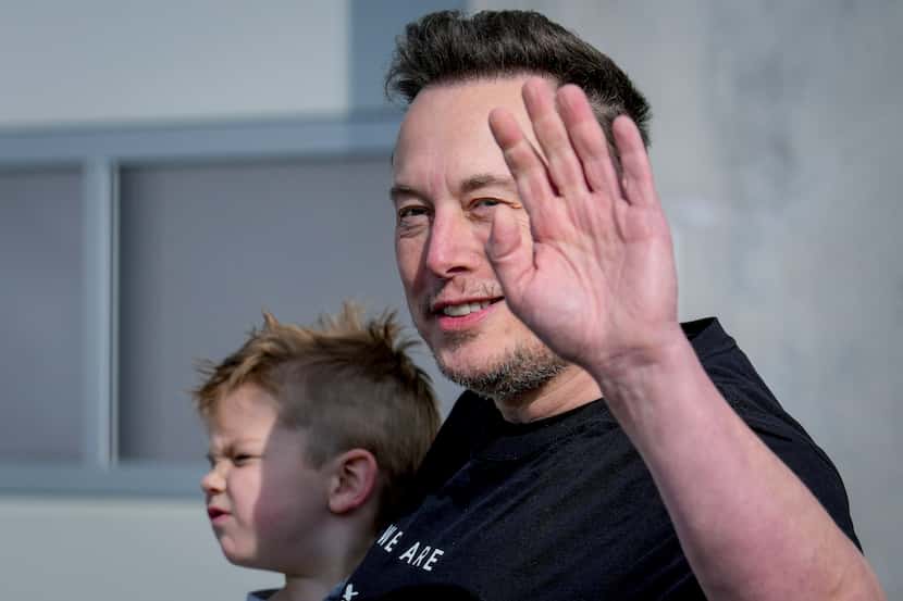 FILE - Tesla CEO Elon Musk waves as he leaves the Tesla Gigafactory for electric cars after...
