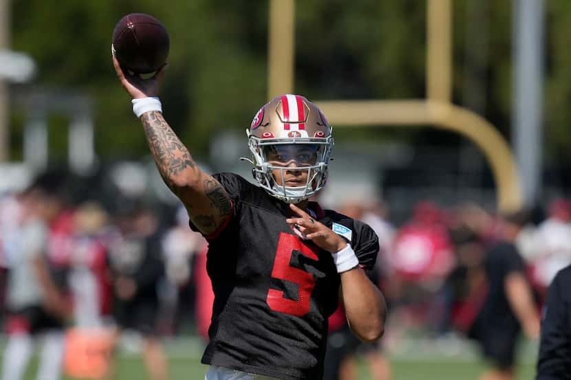 San Francisco 49ers quarterback Trey Lance (5) takes part in drills during the NFL team's...