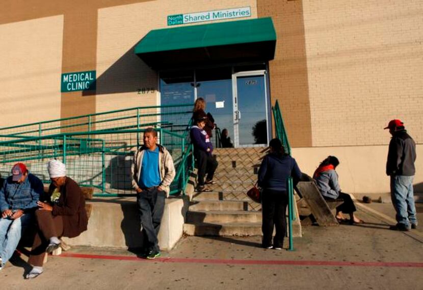 People wait  outside North Dallas Shared  Ministries. Early next year, the Adult Dental...