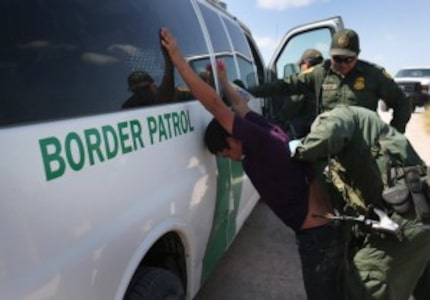  U.S. Border Patrol agents detain undocumented immigrants after they crossed the border from...