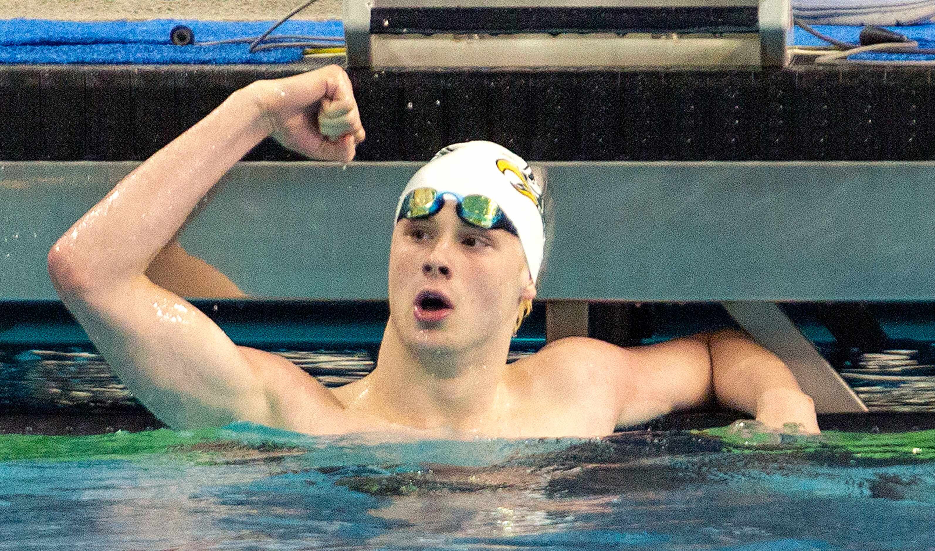 Prosper's Jacob Wimberly celebrates his record breaking swim in the boys 100-yard butterfly...