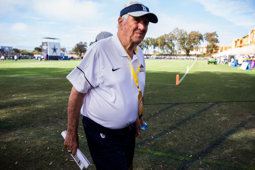 Former Dallas Cowboys vice president of player personnel  Gil Brandt walks off the field...