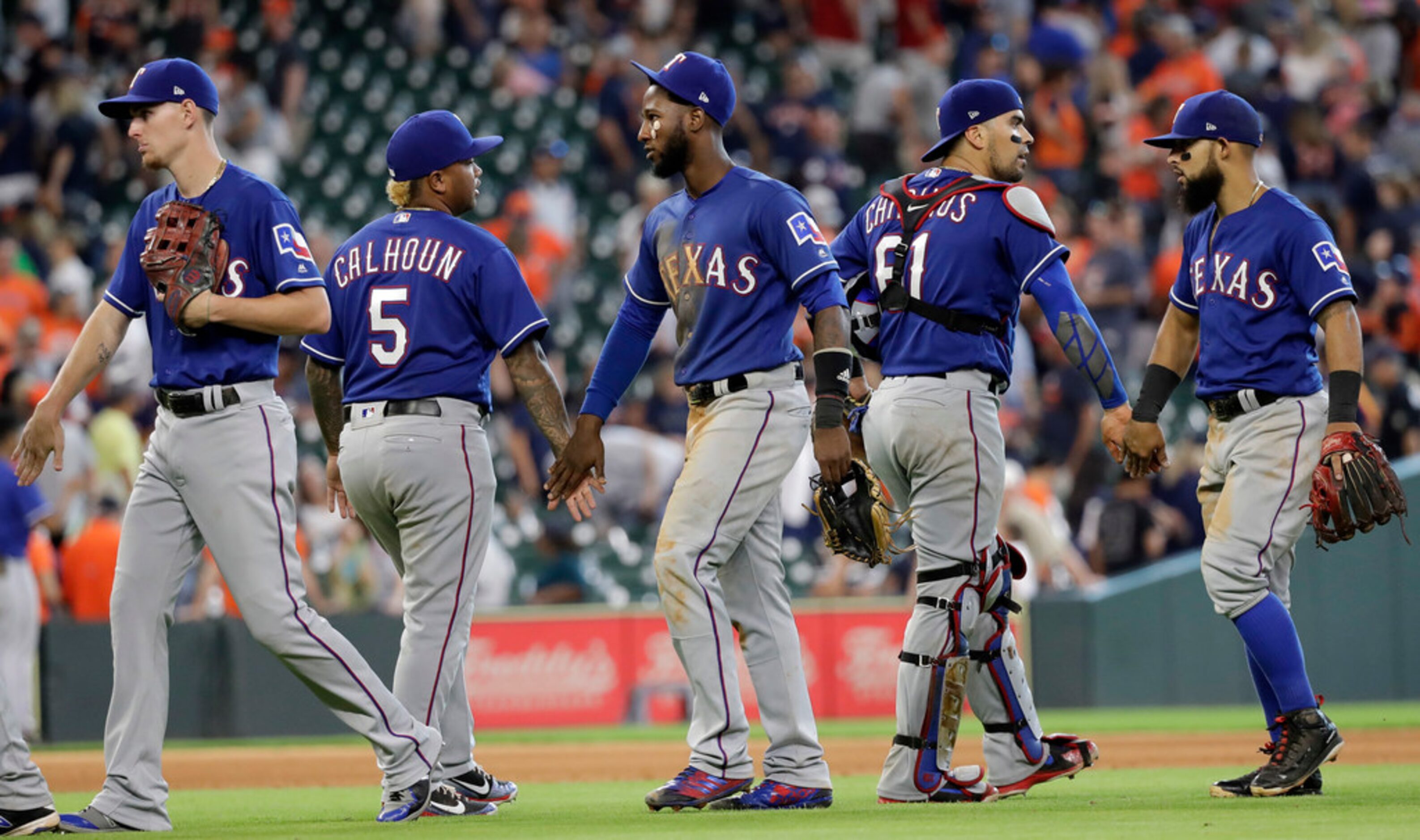 Texas Rangers, left to right, Carlos Tocci, Willie Calhoun (5), Jurickson Profar, Robinson...