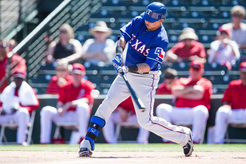 Leonys Martin #2 of the Texas Rangers bats during a spring training game against the Los...
