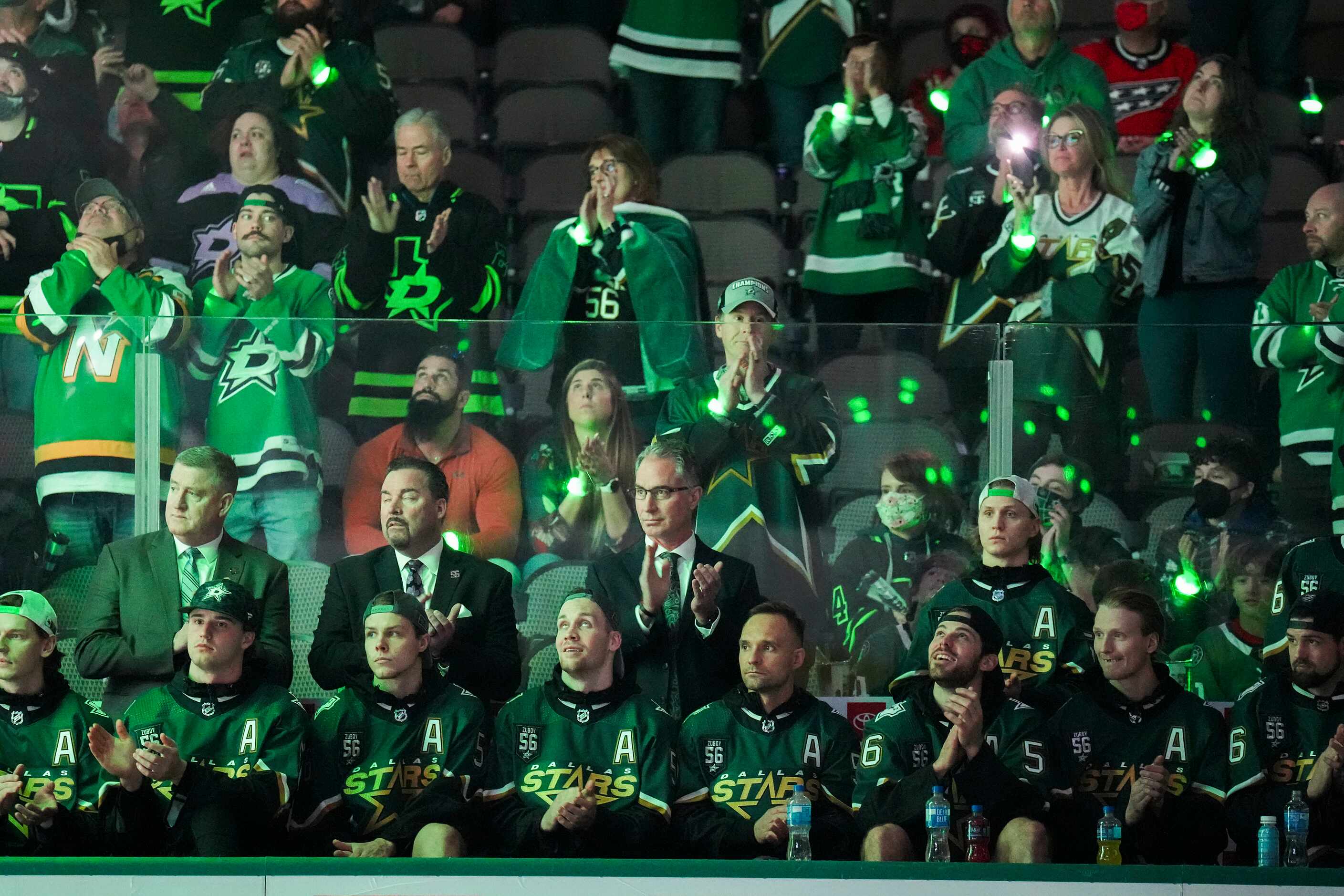 Current Dallas Stars players and coaches applaud during ceremonies former player Sergei...