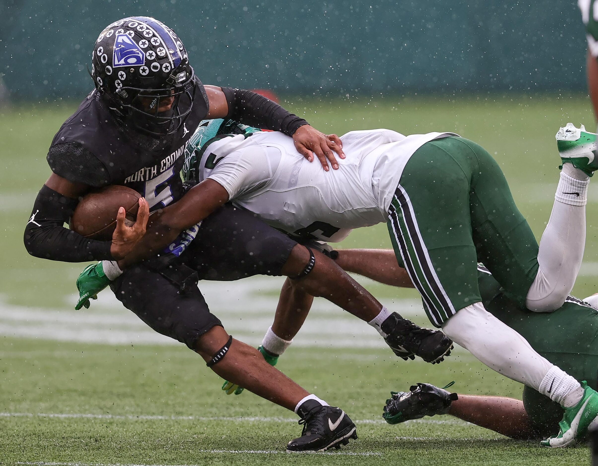 North Crowley running back Dejuan Lacy (5) is hit hard by Prosper defensive back Steven...