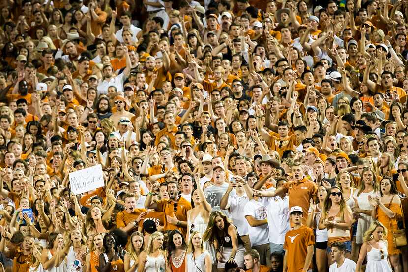 Texas fans cheer after running back Johnathan Gray scored on a 6-yard touchdown run during...