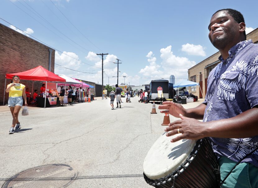 Paulo Dorsey plays the djembe during the Dallas Juneteenth Festival.