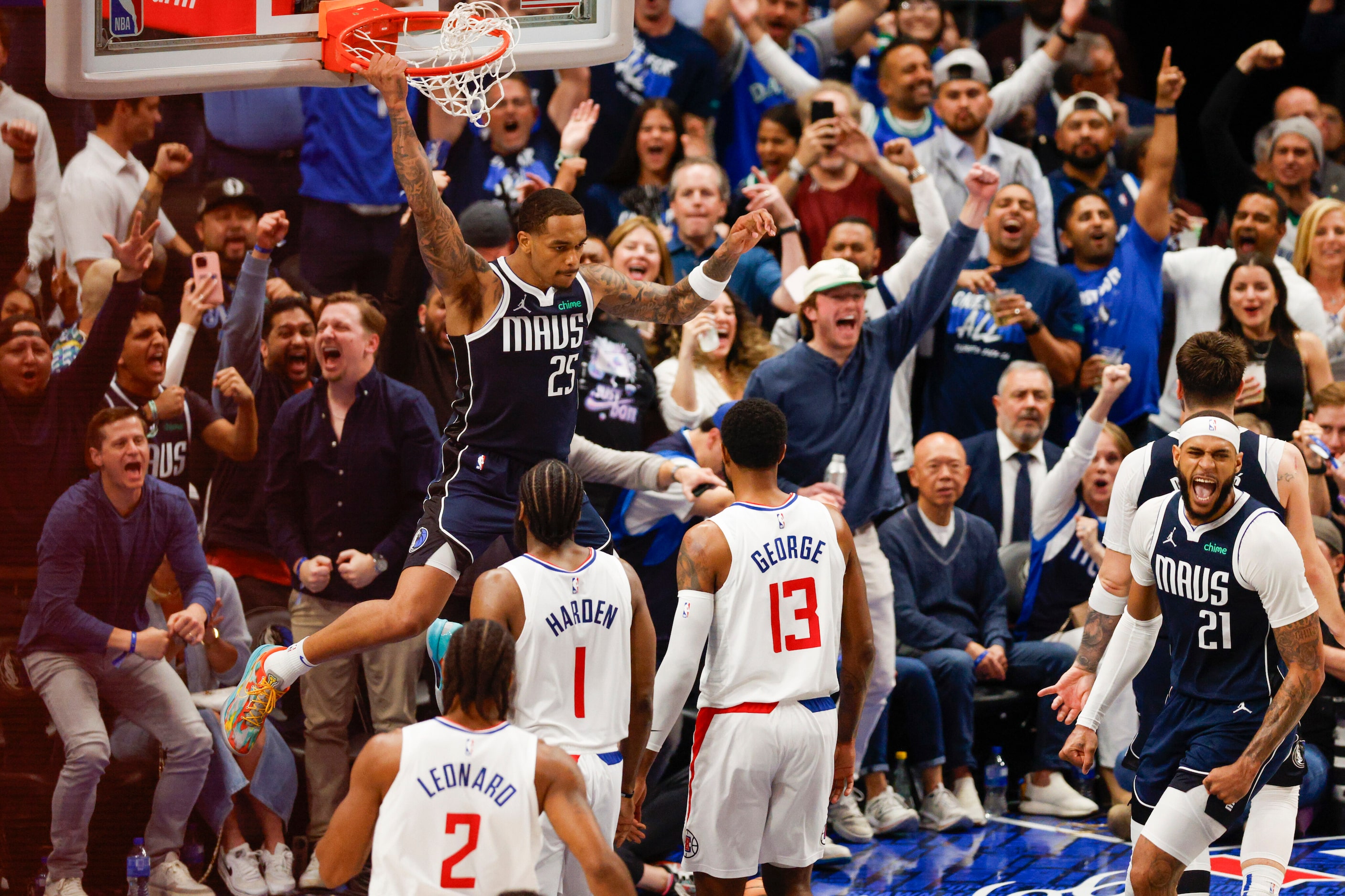 Dallas Mavericks forward P.J. Washington (25) dunks the ball as LA Clippers guard James...