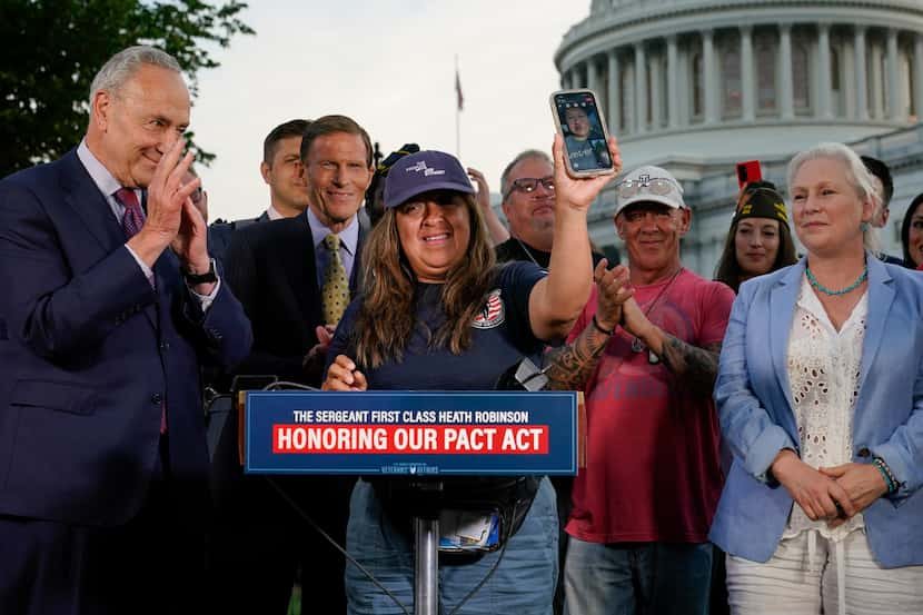 Rosie Torres, center, on a FaceTime call with her husband, veteran Le Roy Torres, who...