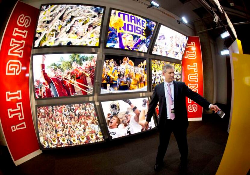 
College Football Hall of Fame CEO and president John Stephenson demonstrates an interactive...