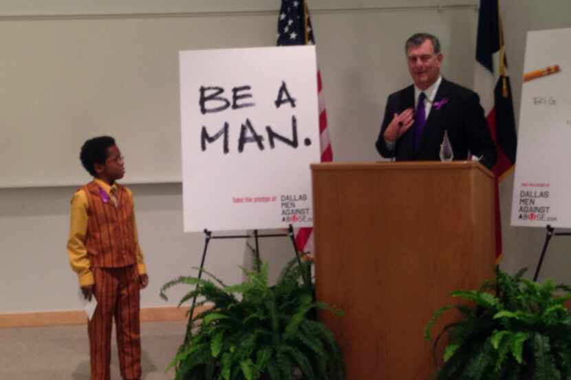 Mayor Mike Rawlings introduced David Williams, 12, at a news conference last week at UT...