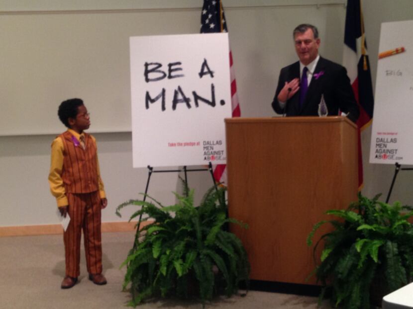 Mayor Mike Rawlings introduced David Williams, 12, at a news conference last week at UT...