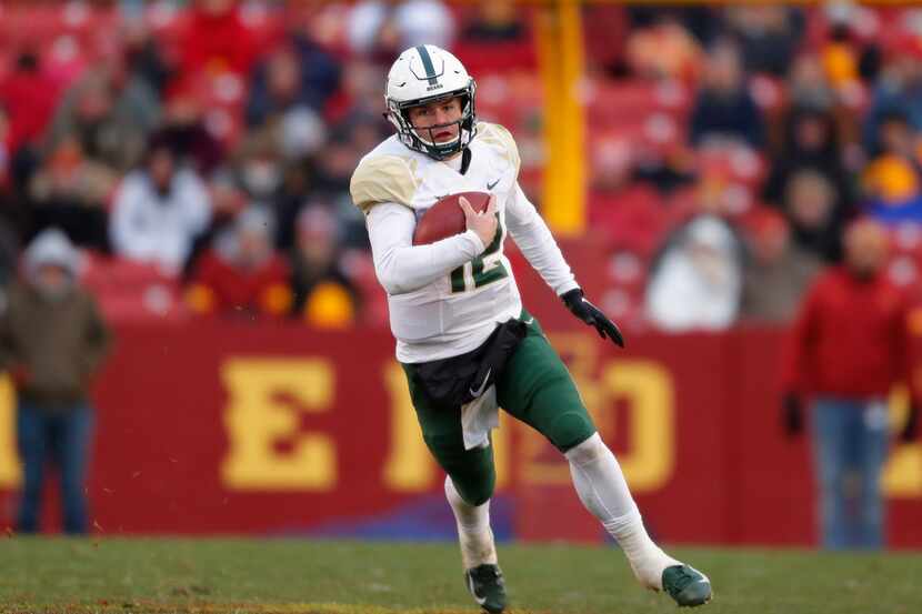 Baylor quarterback Charlie Brewer runs the ball during the first half of an NCAA college...