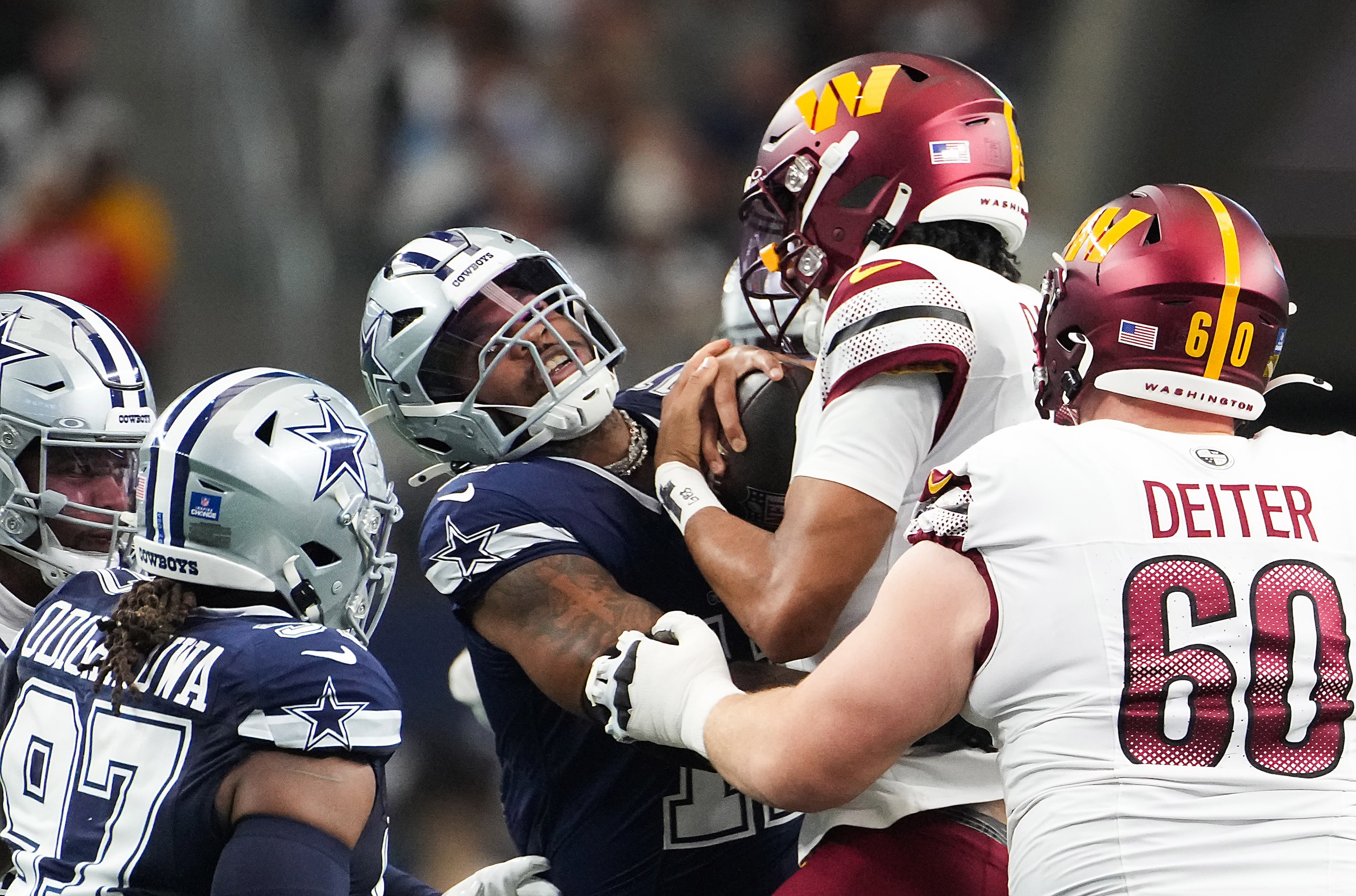 Dallas Cowboys linebacker Micah Parsons (11) sacks Washington Commanders quarterback Jayden...