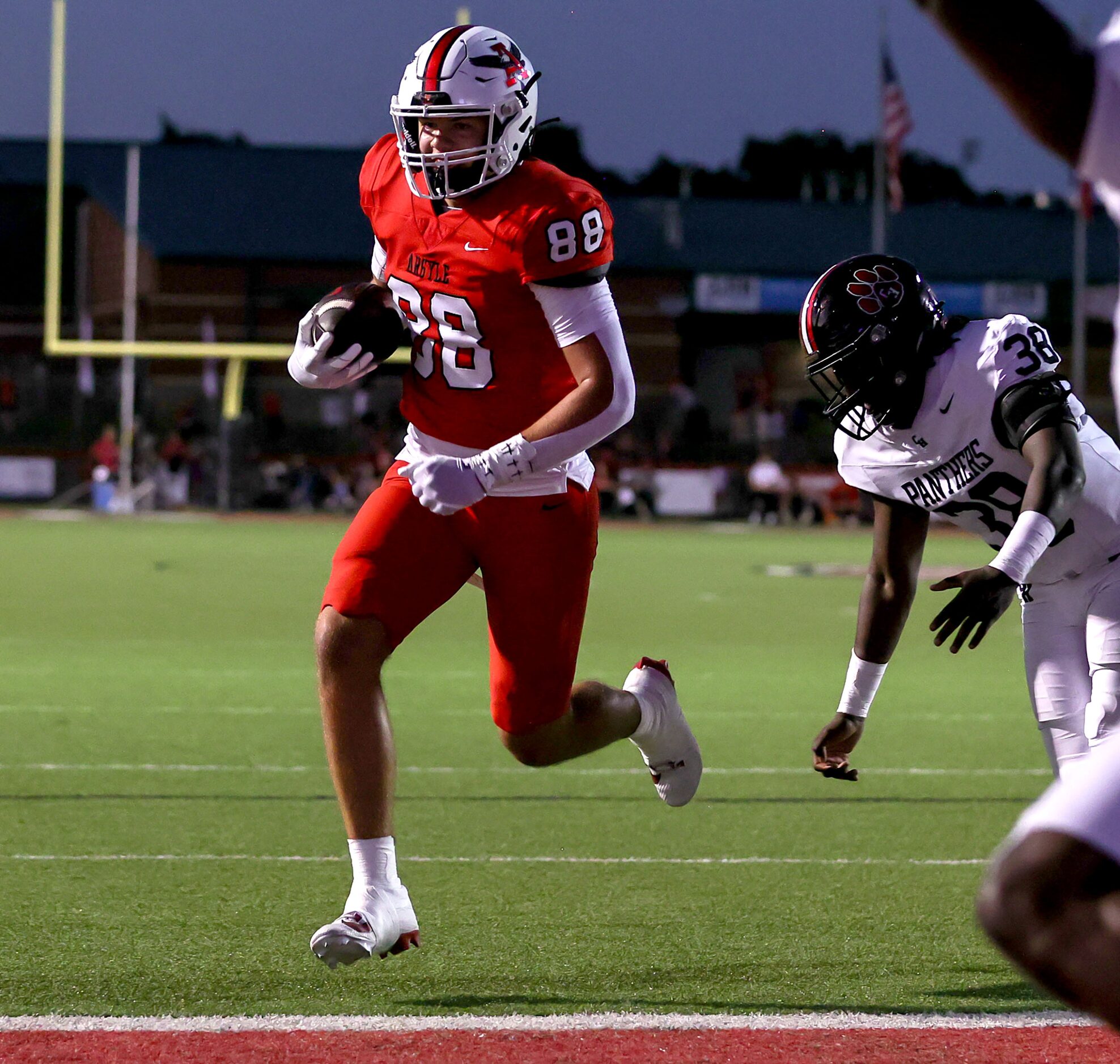 Argyle tight end Braden Bach (88) walks into the endzone past Colleyville Heritage...